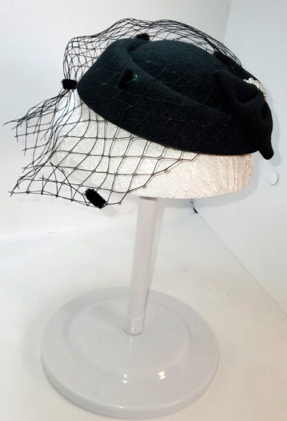 Black bowknot hat. Side view.